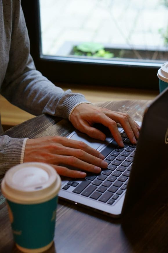 man using laptop at cafe 2022 11 09 17 25 13 utc 1 1 rotated